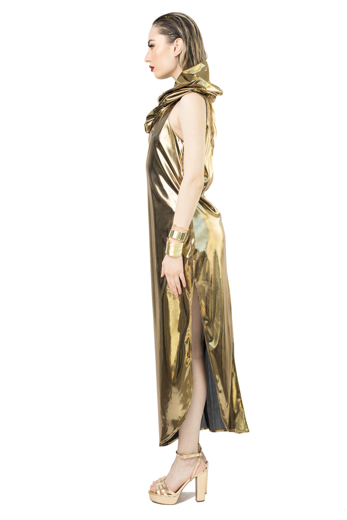 gold dress with hood Anne Hathaway Pairs Gold Dress with a Gold Hood at Met Gala 2015